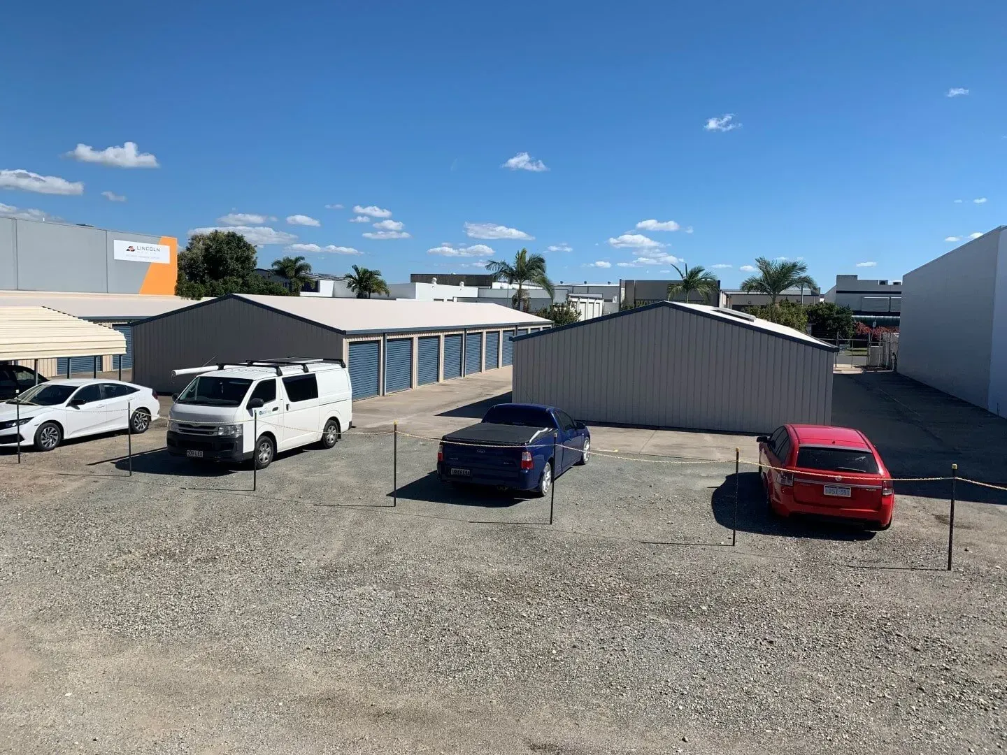 Storage Units and Vehicles Parked on A Gravel Lot Under a Blue Sky — Blue Ridge Self Storage In Paget, QLD