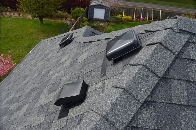 A roof with a lot of vents on it.
