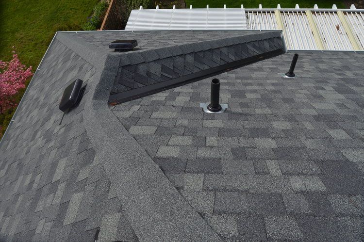 An aerial view of a roof with a chimney on it.