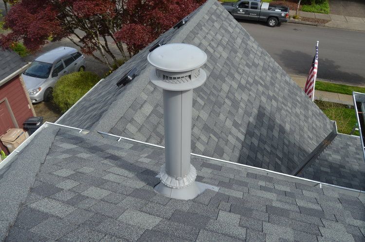 A chimney is on the roof of a house