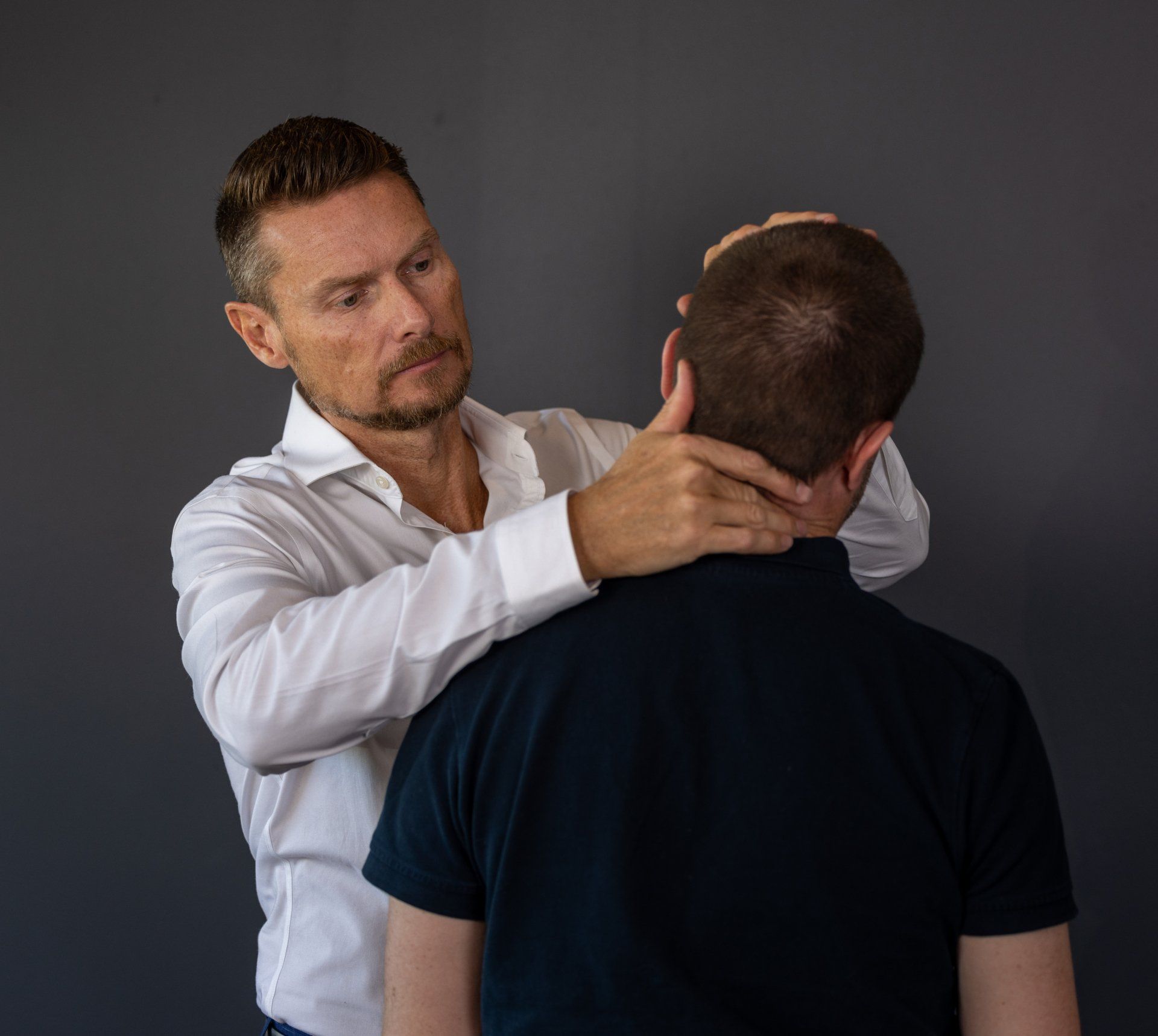 male chiropractor performing shoulder manipulation in Mornington