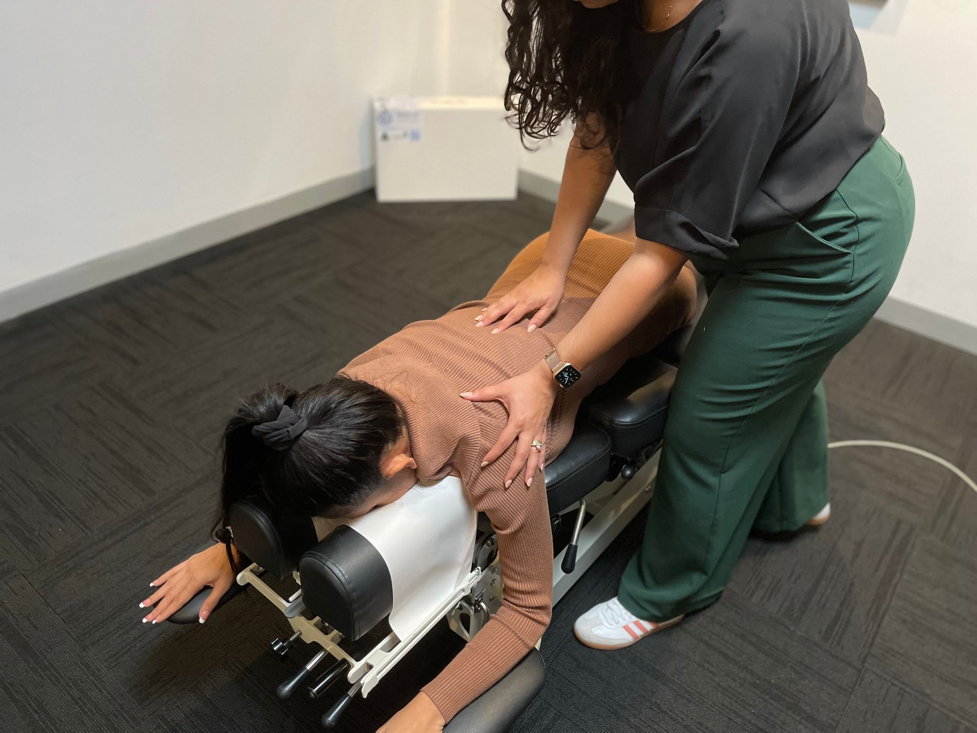 women receiving lower back pain treatment 