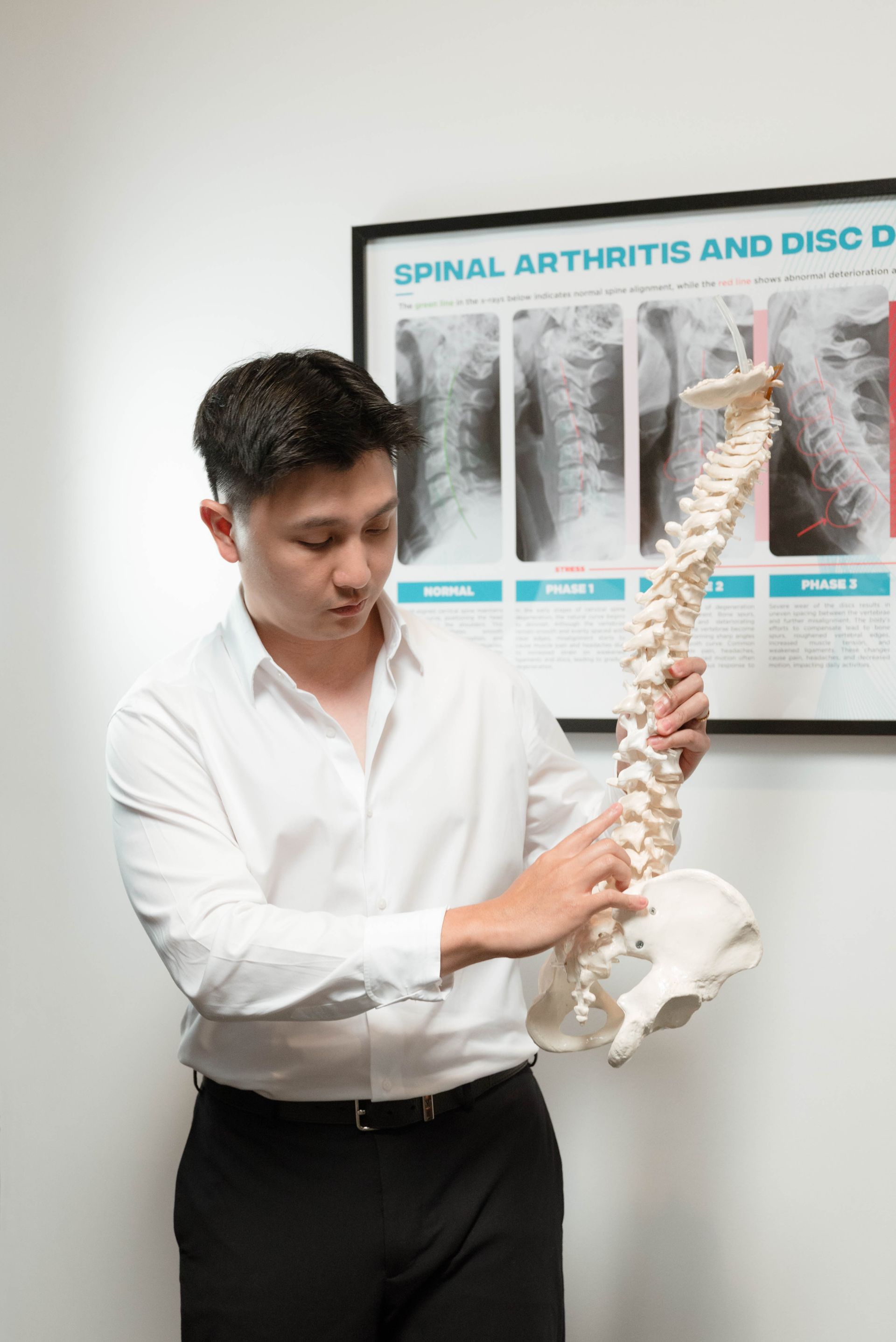 chiro explaining back pain issues like sciatica