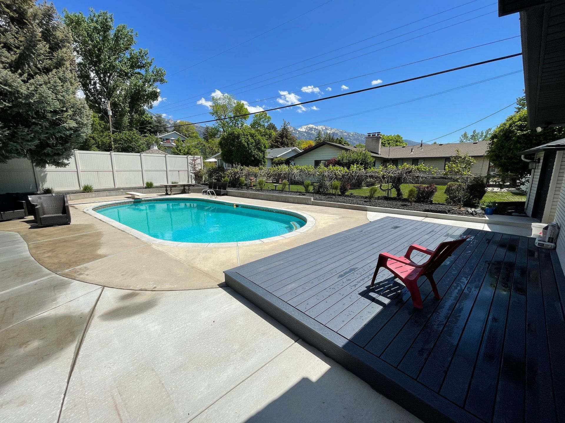 Backyard with a Swimming Pool and a Deck - South Jordan, UT – MD Property Maintenance & Landscaping