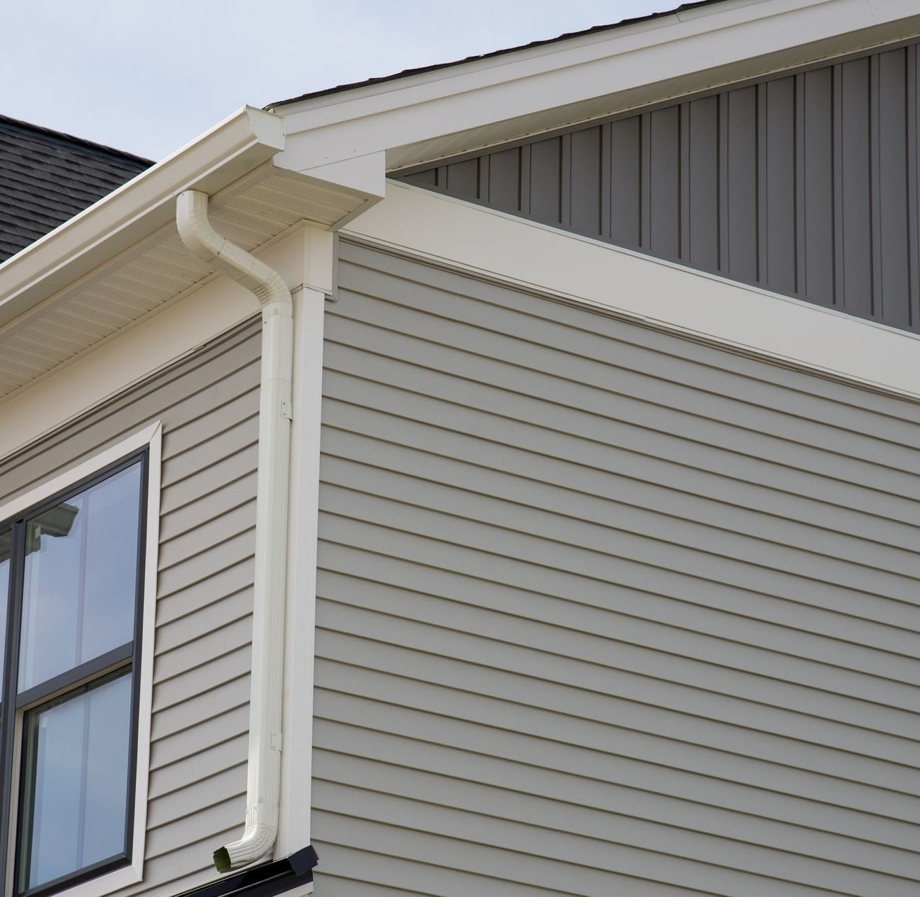 A house with a gutter on the side of it