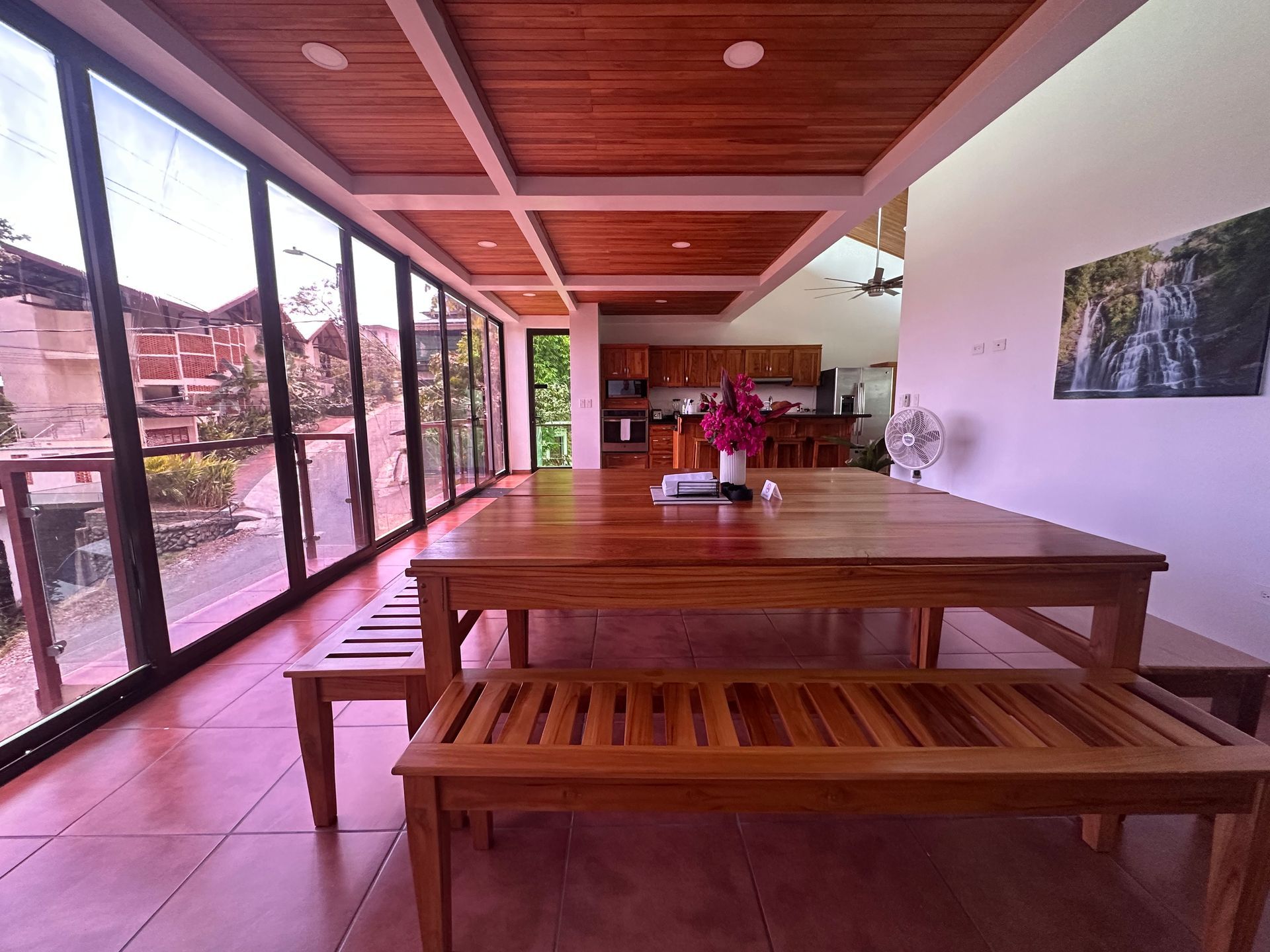A large room with a wooden table and benches