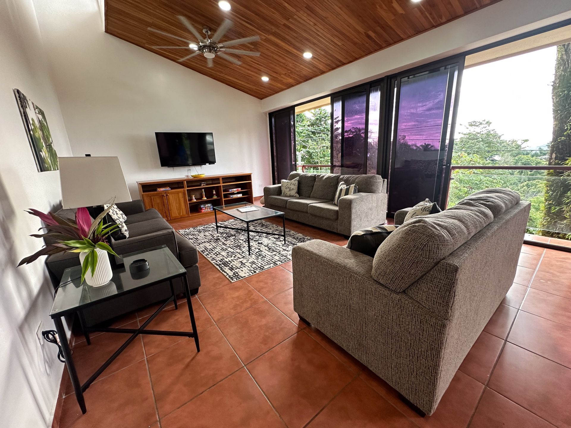 A living room filled with furniture and a flat screen tv.