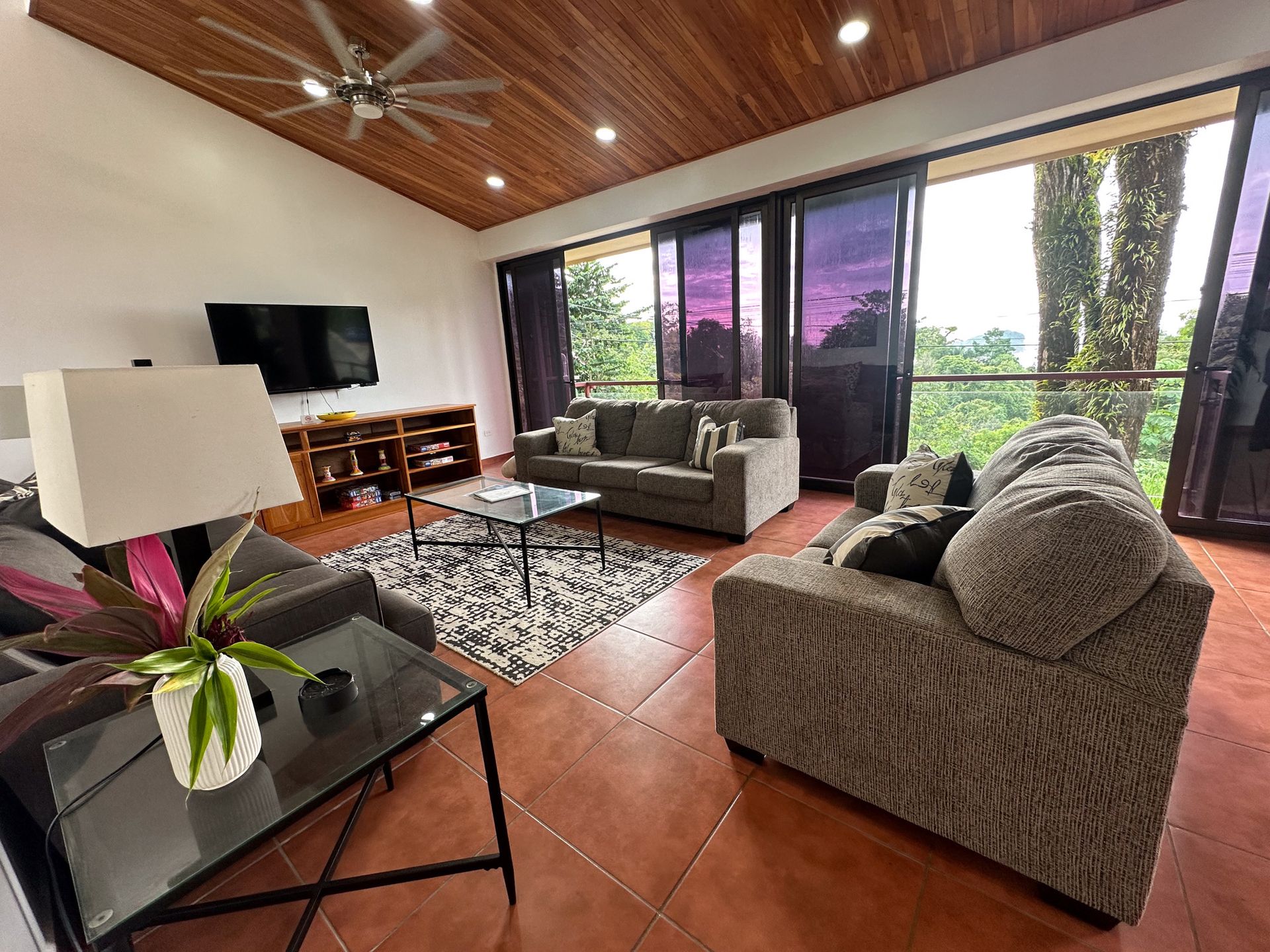 A living room filled with furniture and a flat screen tv.