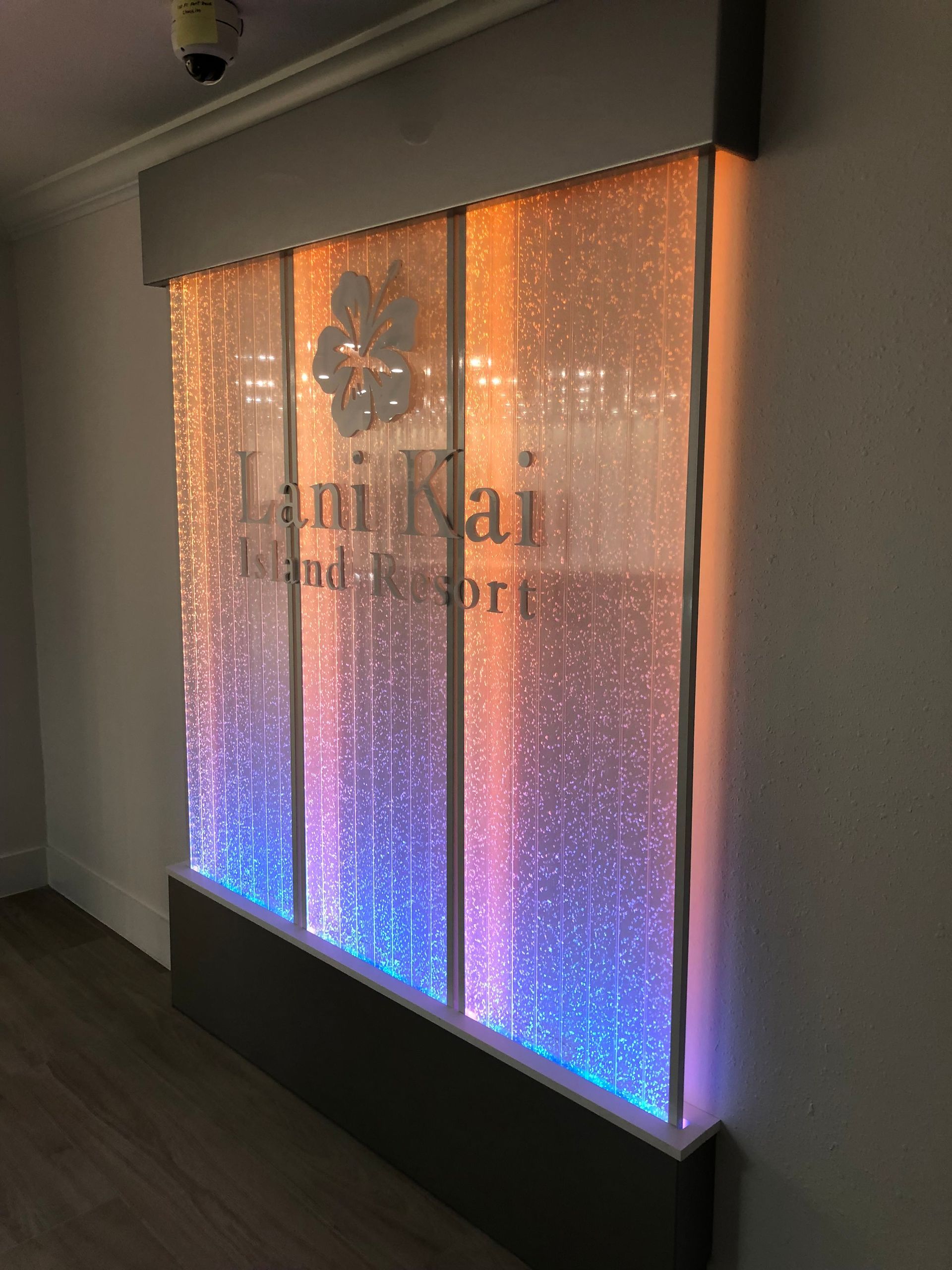 Illuminated Lani Kai Island Resort sign with bubbles and color gradient