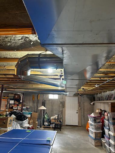 There is a ping pong table in the middle of the room.