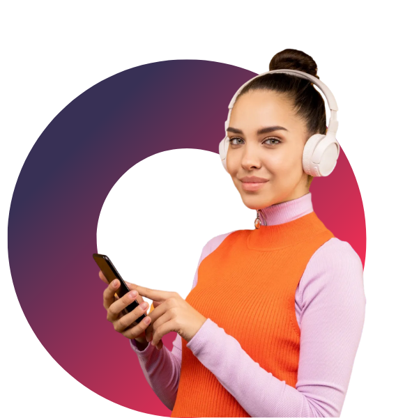A woman wearing headphones is holding a cell phone