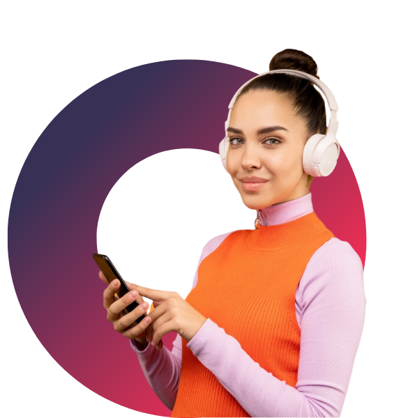A woman wearing headphones is holding a cell phone