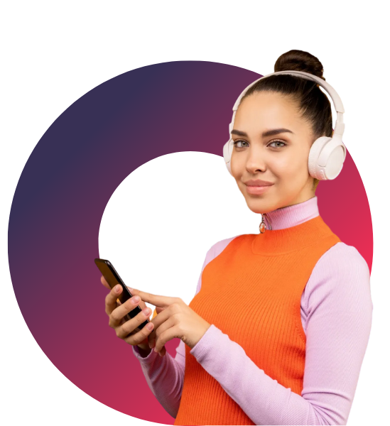 A woman wearing headphones is holding a cell phone