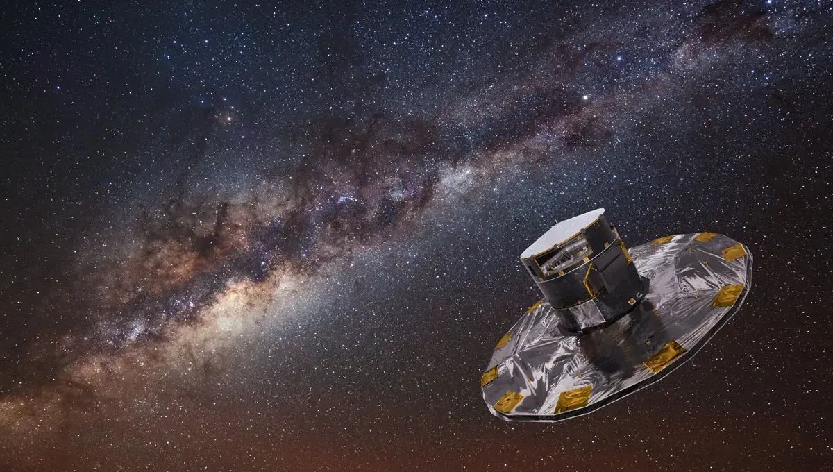 A satellite, with a large sunshield, against the Milky Way galaxy's starry background.