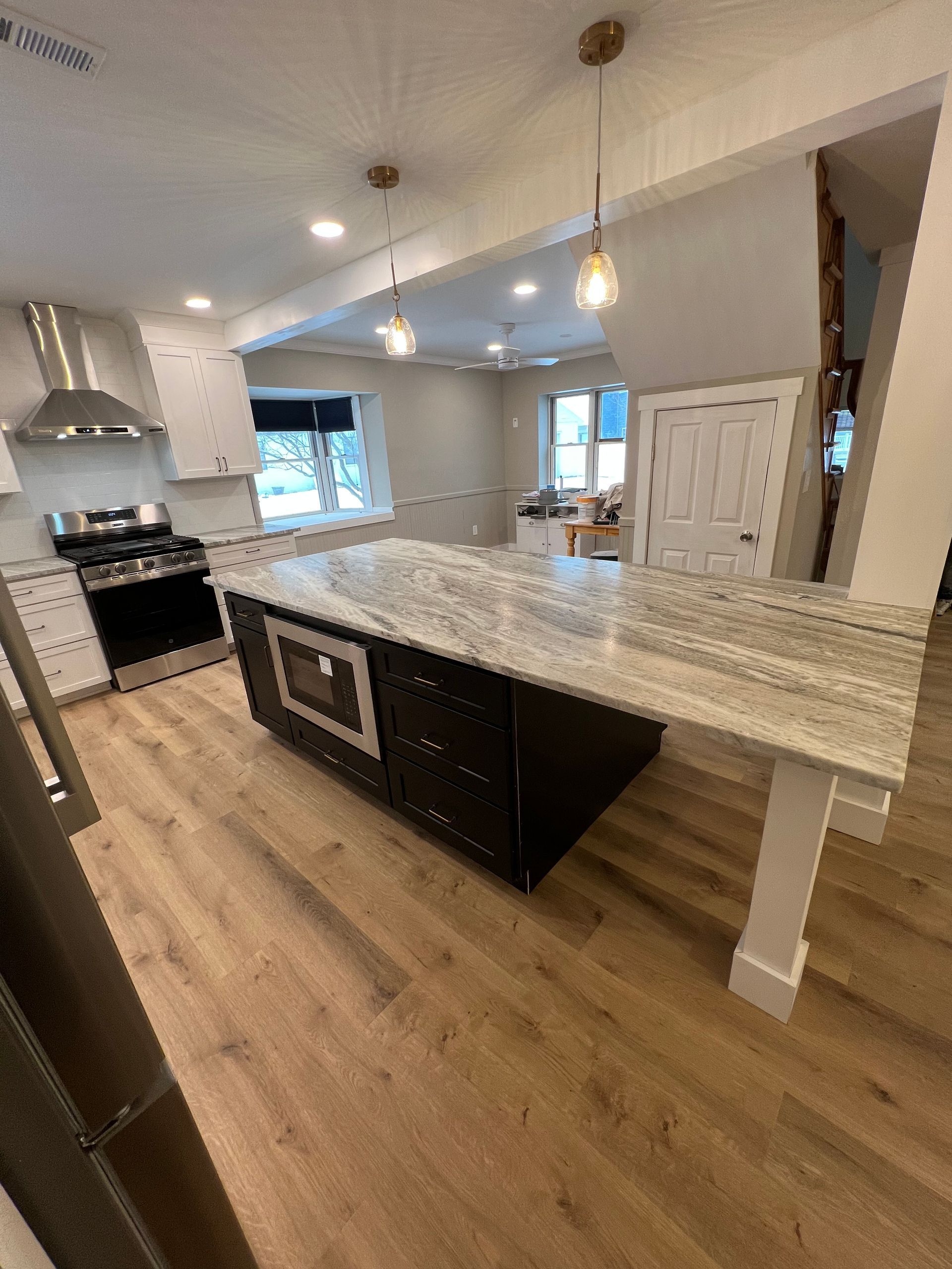 A kitchen with a large island in the middle of it.