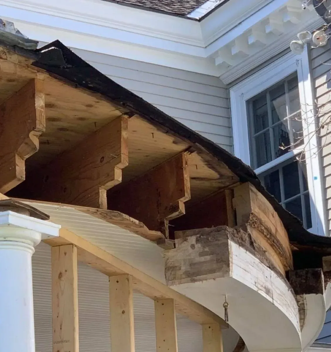 A house with a roof that is being repaired