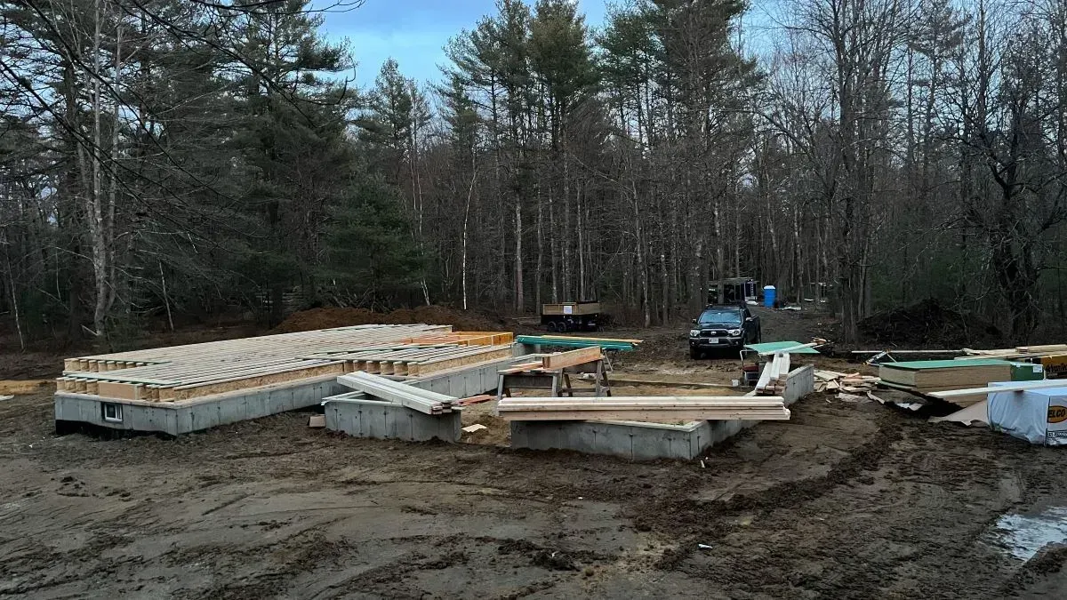 A house is being built in the middle of a forest.