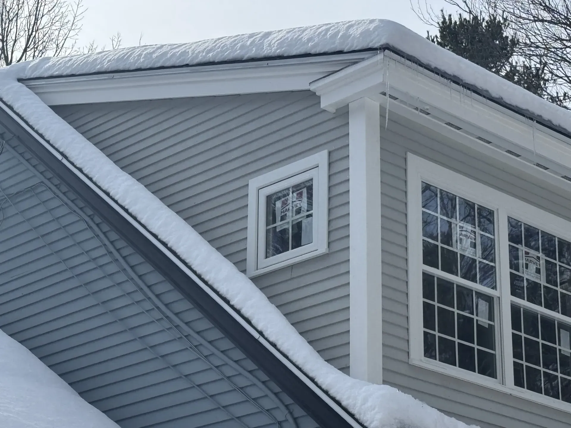 A house with a lot of snow on the roof