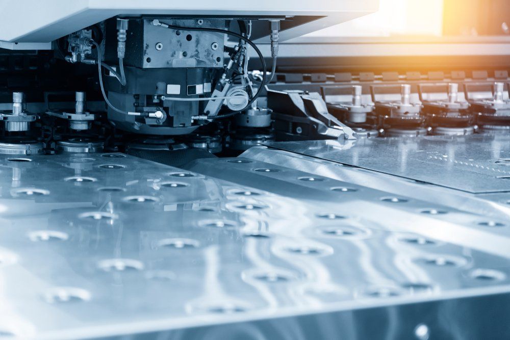 A Machine Is Cutting a Piece of Metal in A Factory — North Coast Steel in Crescent Head, NSW