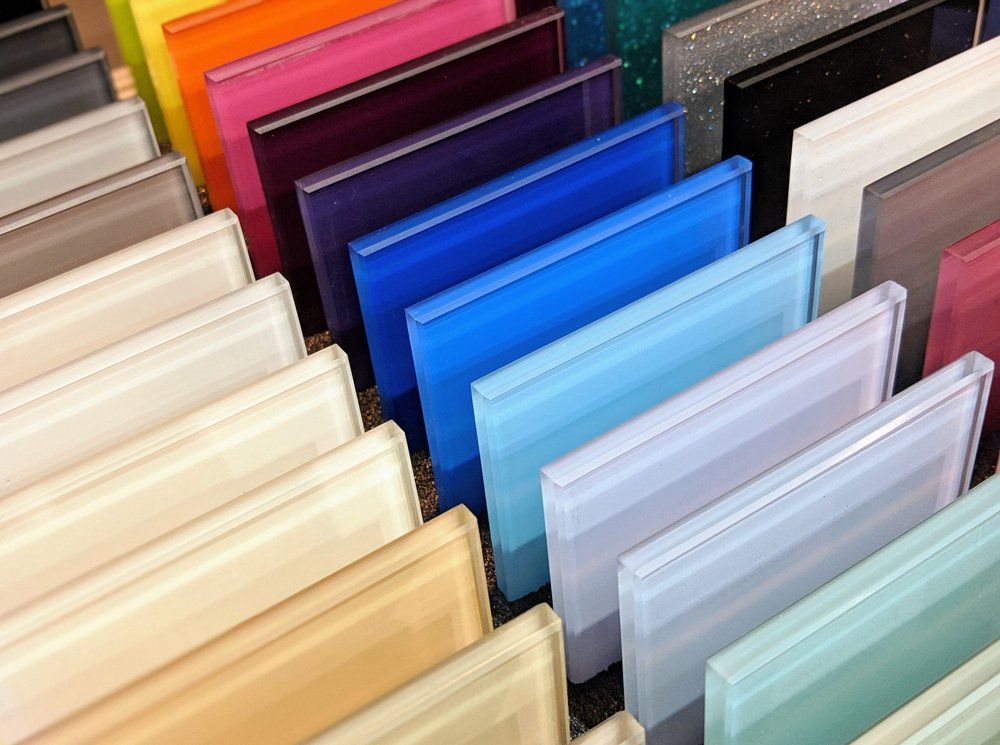 A Bunch of Different Colored Acrylic Sheets Are Stacked on Top of Each Other — North Coast Steel in South Kempsey, NSW