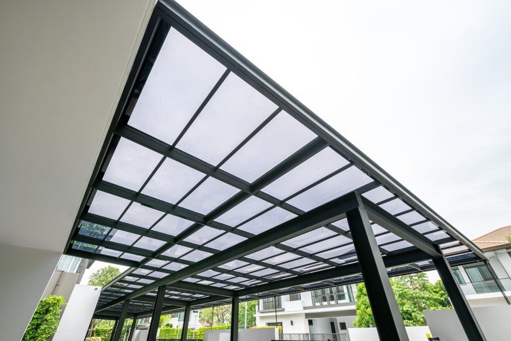 A Carport with A Clear Roof and A Black Frame — North Coast Steel in South Kempsey, NSW