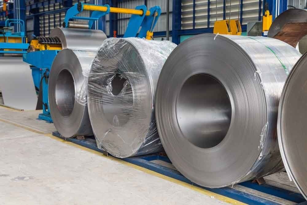 A Row of Metal Rolls Sitting on Top of Each Other in A Factory — North Coast Steel in South Kempsey, NSW