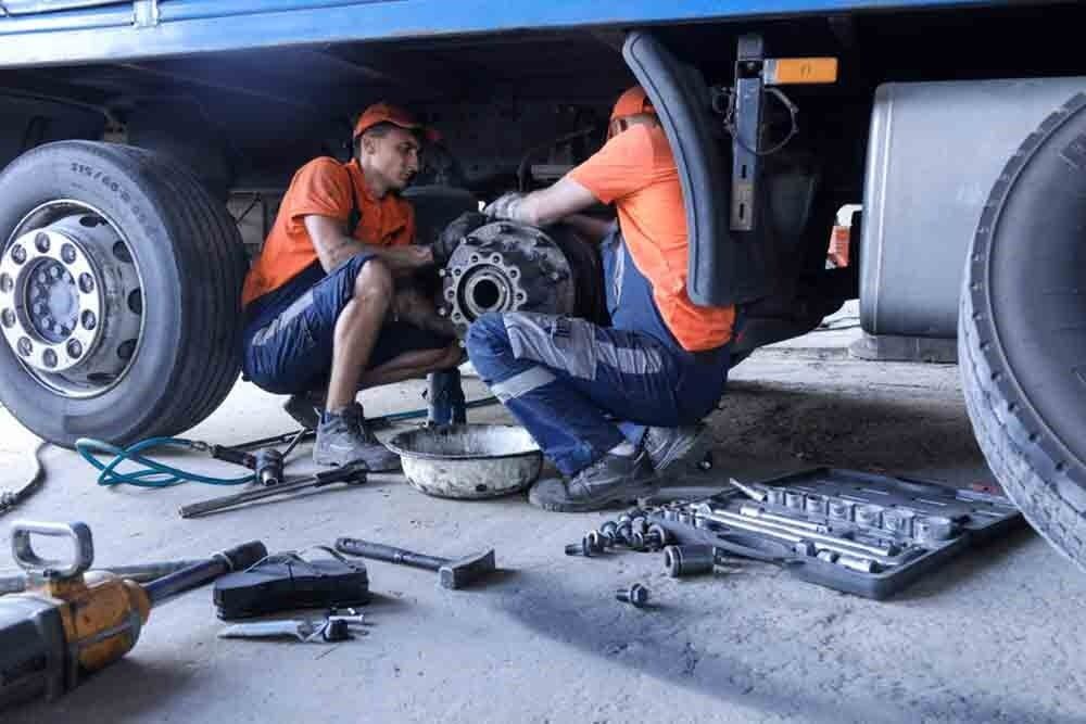 Two Men Are Working on A Truck in A Garage — North Coast Steel in South Kempsey, NSW