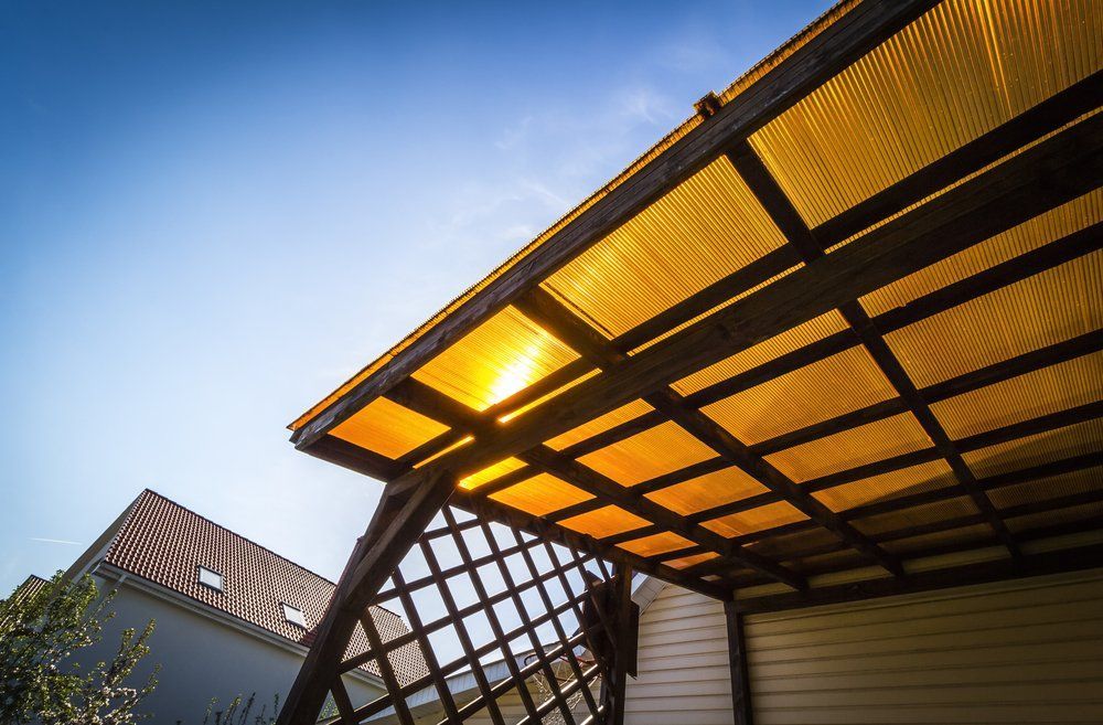 A Pergola with A Yellow Roof and A Light on It — North Coast Steel in Crescent Head, NSW