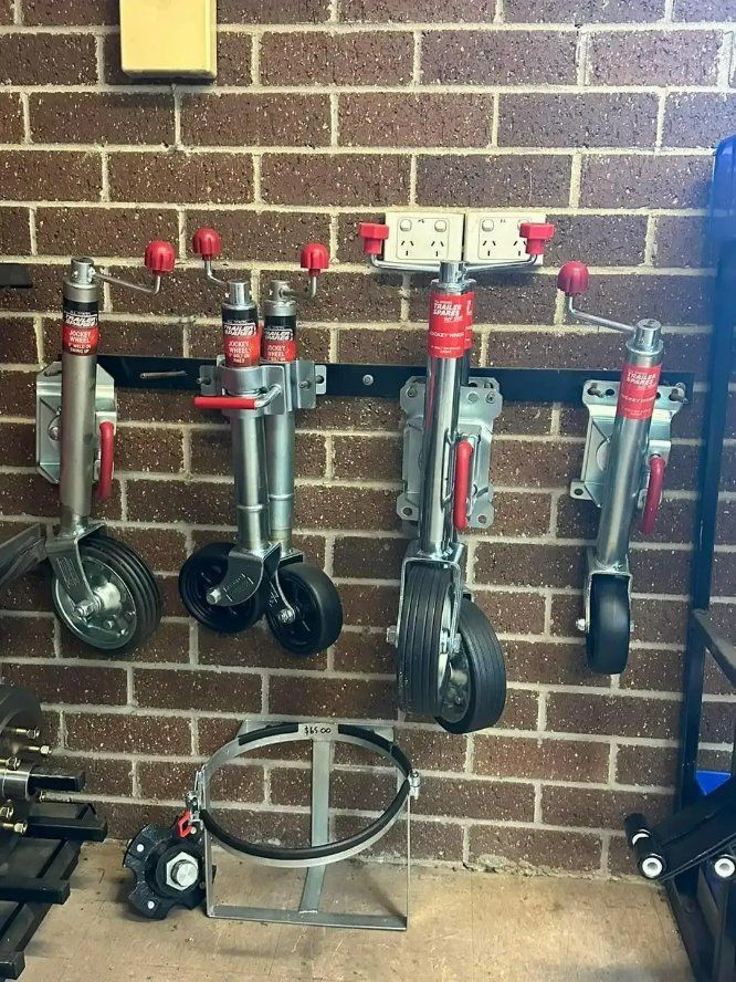 A Bunch of Wheels Are Hanging on A Brick Wall — North Coast Steel in South Kempsey, NSW
