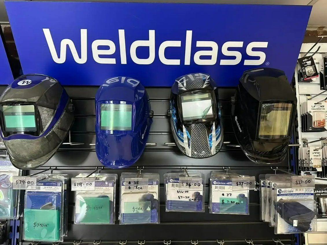 A Display of Welding Helmets Under a Sign that Says Weldclass — North Coast Steel in South Kempsey, NSW