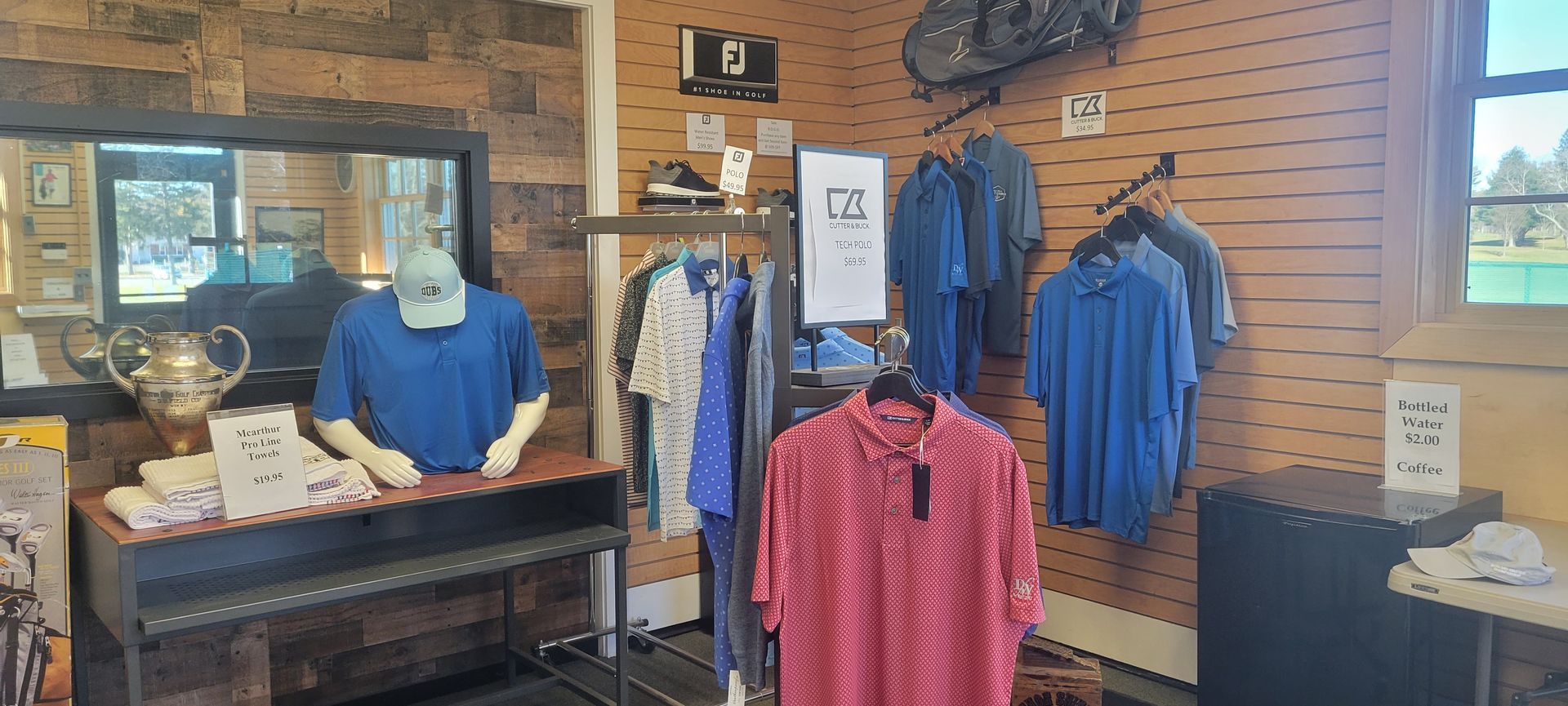 A store filled with clothes and a mannequin.