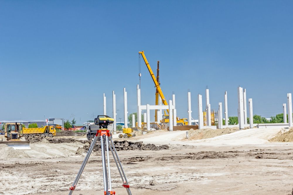 A Construction Site With a Crane in the Background — Coastal Surveying Group Pty Ltd in Baringa, QLD