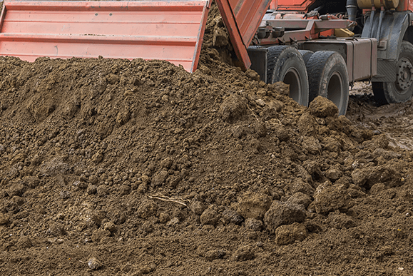 Dump Truck Unloading Top Soil — Newark, OH — Newark Materials, LLC