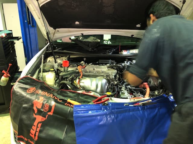 Mechanic Working on the Car Engine — Dyna Automotive in Paget, QLD