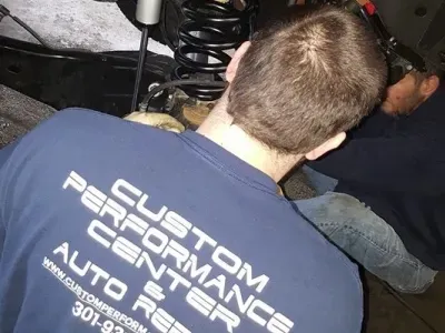 Our Mechanic is Working on a Vehicle in White Plains, MD - Custom Performance Center Auto Repair & Towing