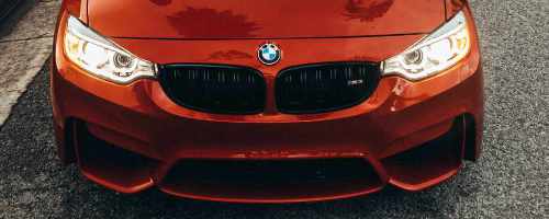 glossy front end of a red BMW