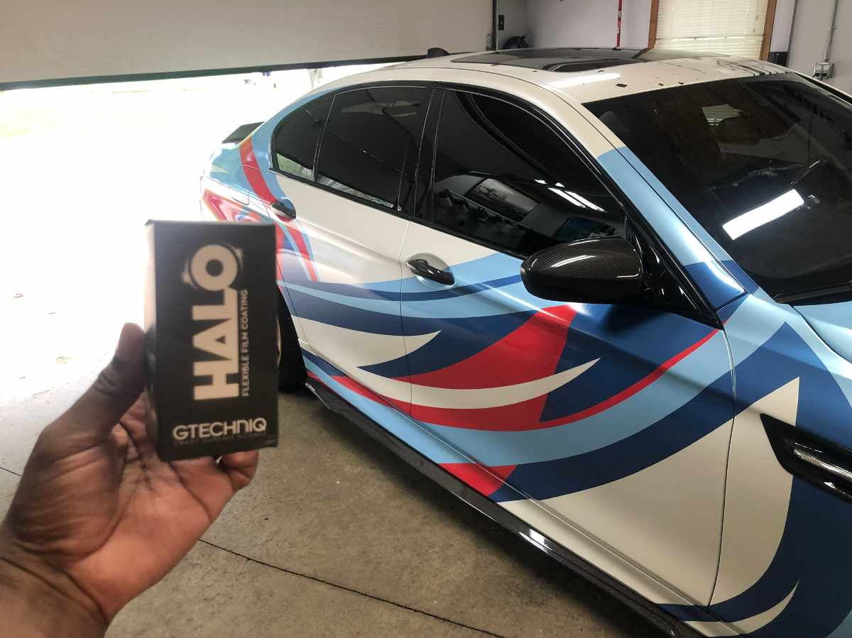 custom wrapped BMW with abstract blue , red and white colors