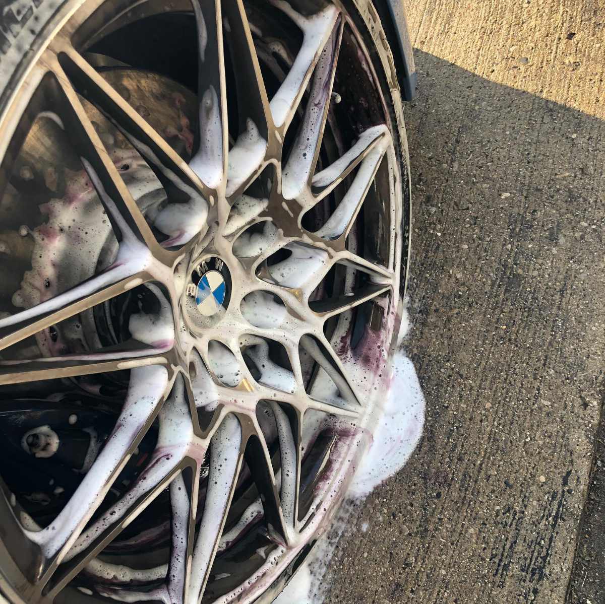 foam on a silver BMW wheel