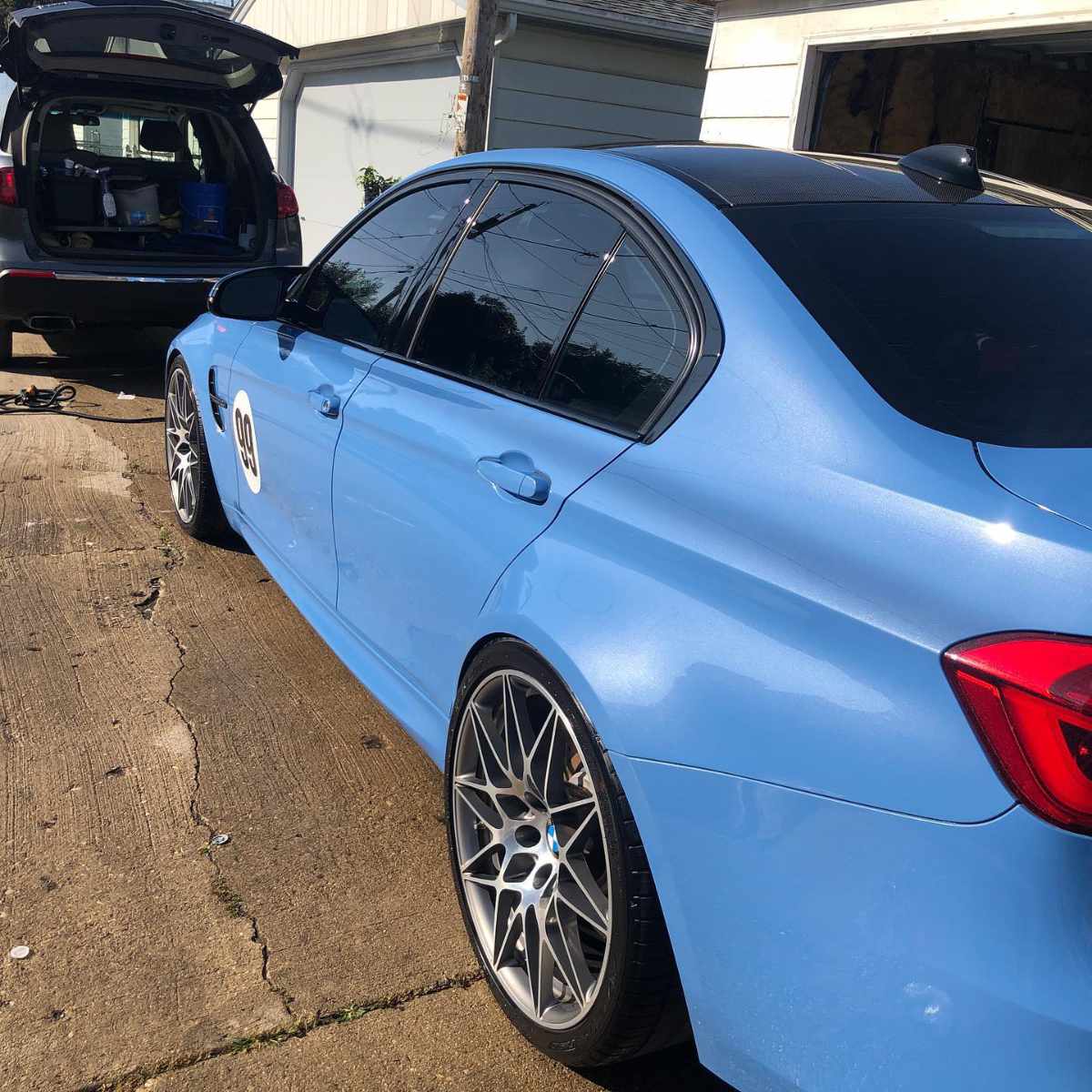 clean blue BMW side rear