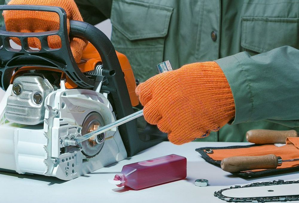 Repairing Chainsaw In Repair Shop — Gloucester Outdoor Solutions In Gloucester, NSW