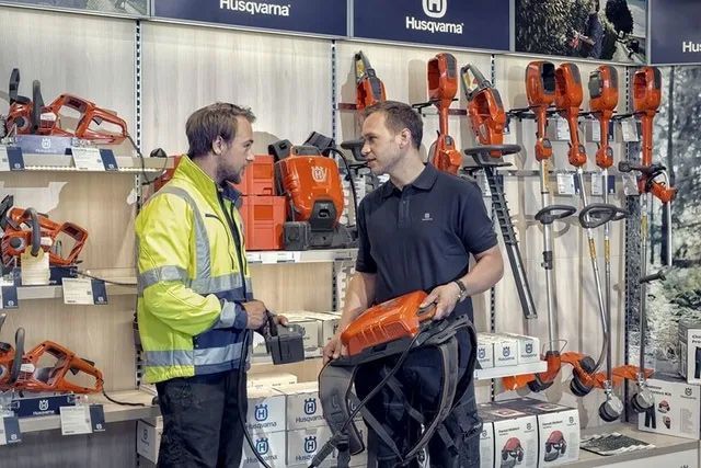 Two Men Talking About The Tools Display In The Shop — Gloucester Outdoor Solutions In Gloucester, NSW