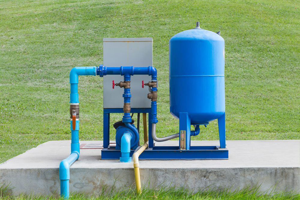Water Pump System On Concrete And Green Grass — Gloucester Outdoor Solutions In Gloucester, NSW