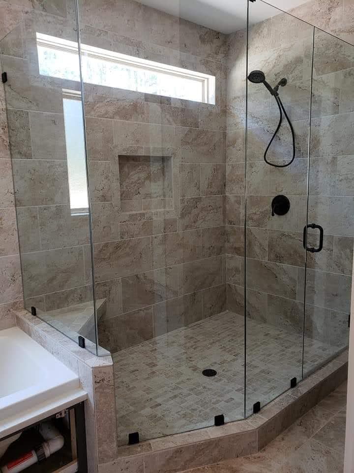 A bathroom with a sink , toilet and mirror.