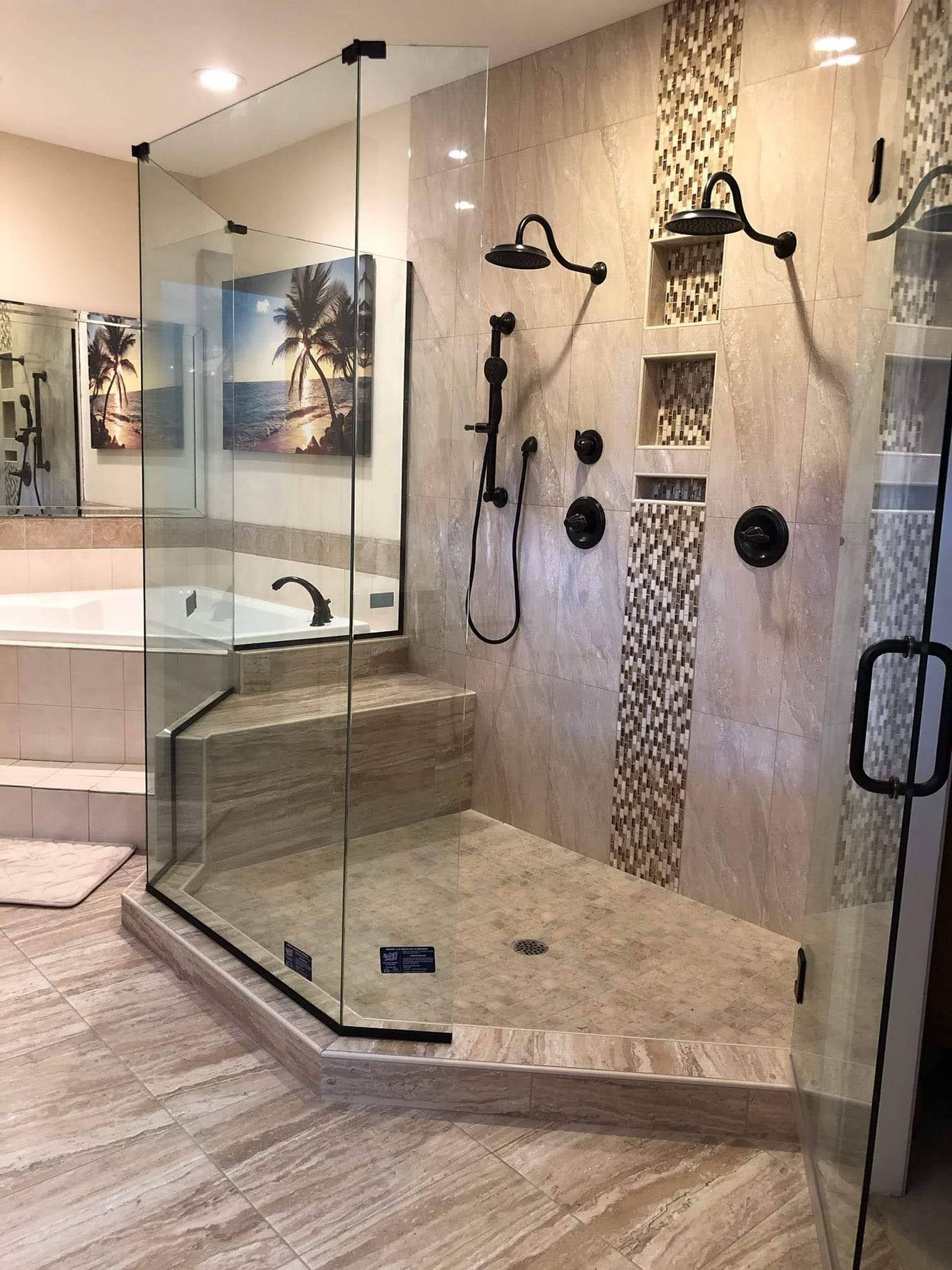 A bathroom with a walk in shower and a bathtub.