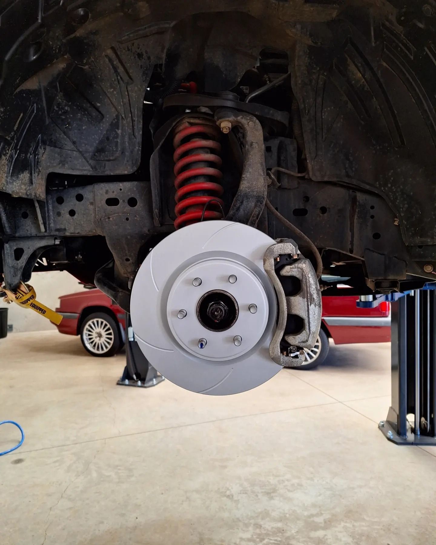 A close up of a brake disc on a car.