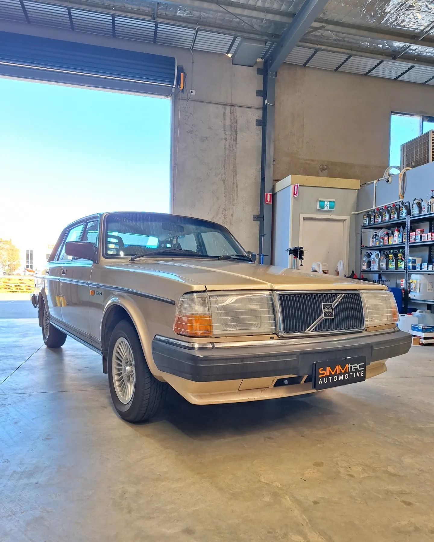 A volvo car is parked in a garage.