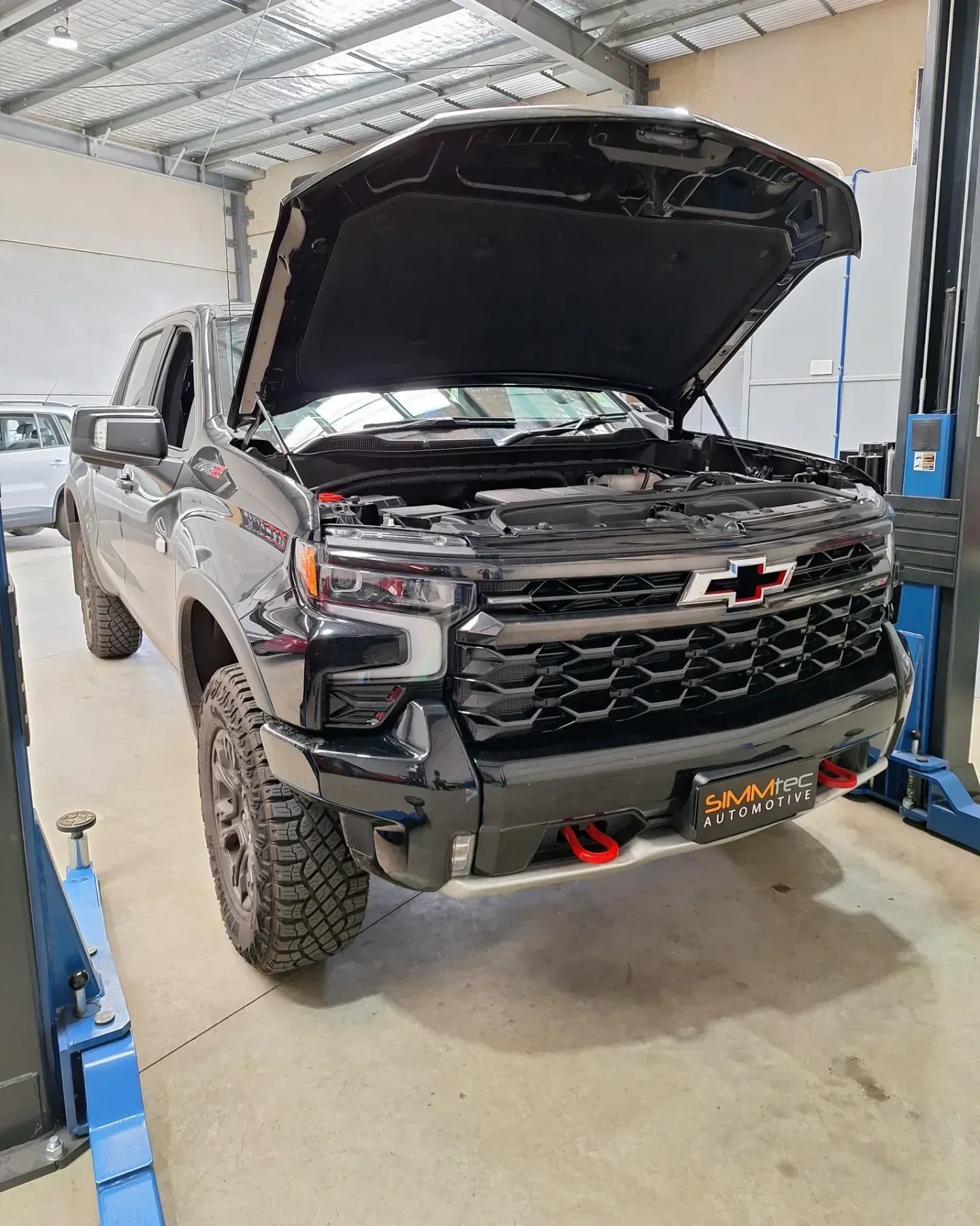 The hood of a red volkswagen.