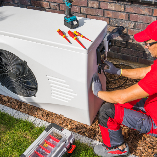 HVAC technician servicing a unit