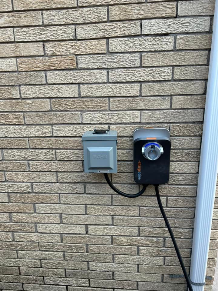 A Brick Wall With A Switch And A Timer Attached To It | Albuquerque, NM | Tesla Electric LLC