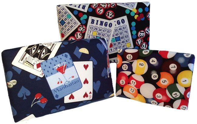 Three wallets with a bingo card and pool balls on them